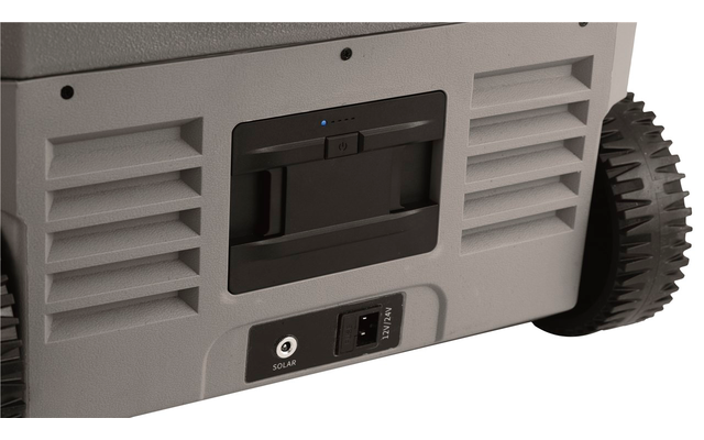 Ansicht eines grauen Geräts mit Lüftungsschlitzen, einem Ein- und Ausschalter und einem großen schwarzen Rad