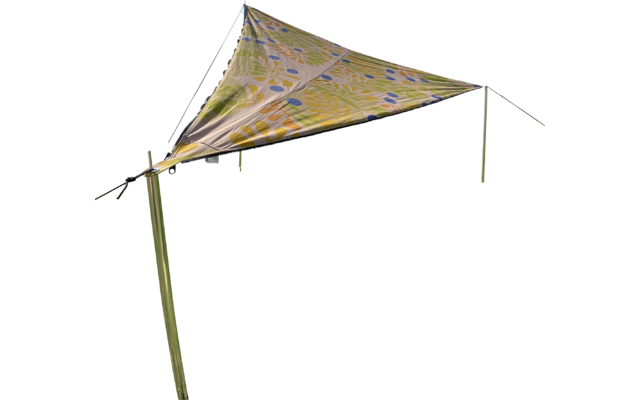 Triangular, colorful patterned sunshade on a green meadow under a blue sky with some clouds