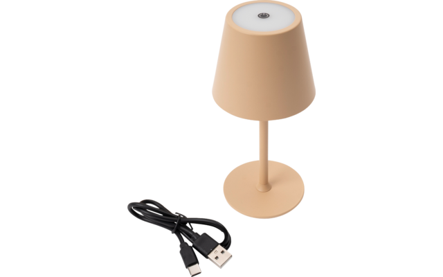 Small beige table lamp with round shade, white light surface and small round button on top; beside it two black cables with USB‑A and USB‑C connectors