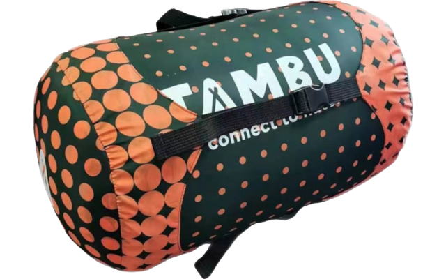 Cylindrical rolled fabric item with a black carrying strap, dark green background, orange polka dots and white text "TAMBU"