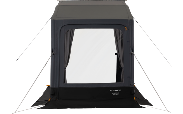 Struttura rettangolare grigia in tessuto con grande finestra centrale translucida, due tendine laterali, pannello inferiore scuro e quattro tiranti estesi verso l'esterno