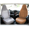 Interior of a vehicle with two different seats, the left seat is gray, the right one is brown