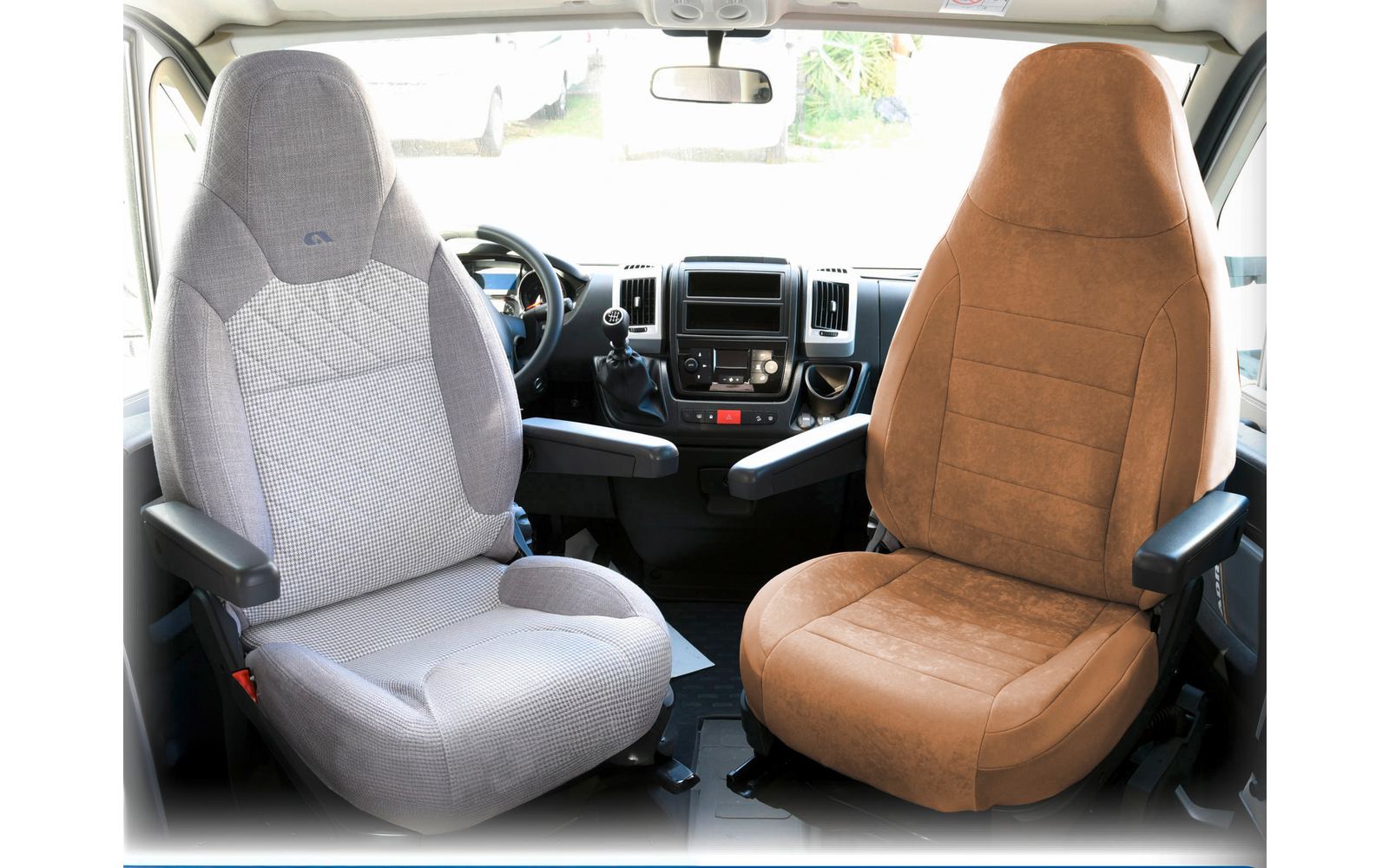 Interior of a vehicle with two different seats, the left seat is gray, the right one is brown