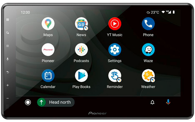 Touchscreen display with Pioneer logo showing app icons (Maps, News, YT Music, Phone, Pioneer, Podcasts, Settings, Waze, Calendar, Play Books, Reminder, Weather), status bar with time 12:00 and 23°C, bottom bar showing 'Head north'