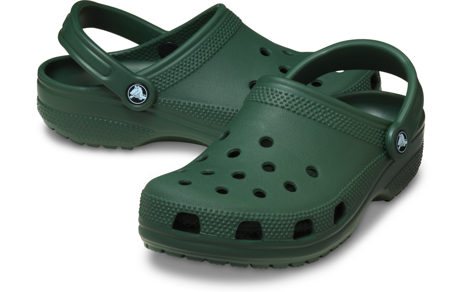 Paar grüne Kunststoff-Clogs mit Belüftungsöffnungen und Fersenriemen, auf weißem Hintergrund