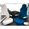 Two vehicle seats, one white and one blue, with armrests inside a vehicle interior