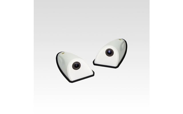 Zwei weiße, keilförmige Objekte mit runden schwarzen Linsen und schwarzen Sockeln auf hellem Verlaufshintergrund