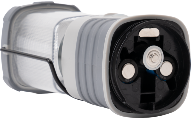 Grijs-witte inklapbare lantaarn met transparante geribbelde kap, metalen handgreep en open batterijvak met drie zichtbare contactplaten