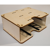 Light plywood box with cutouts on the front and top, two black metal rails inside, on a white background