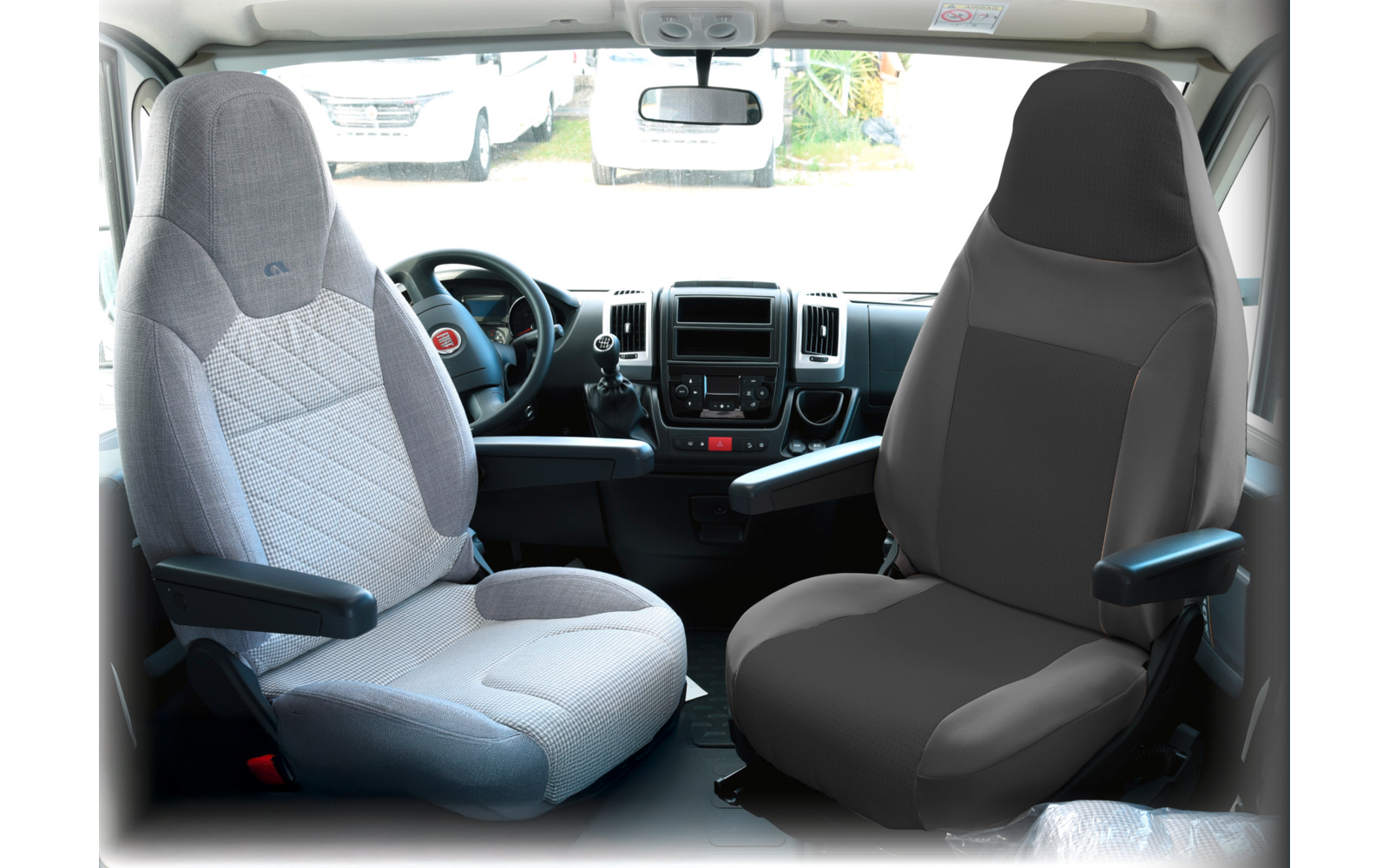 View of two front seats and the dashboard inside a vehicle