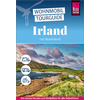 Buchcover mit Titel 'Wohnmobil Tourguide Irland mit Nordirland', Logo 'Reise Know-How', Foto einer Küstenlandschaft mit Meer, grasbedeckten Hügeln, einer Straße und einem geparkten Wohnmobil, drei Camper-Icons und einer pinken Leiste mit Zusatztext