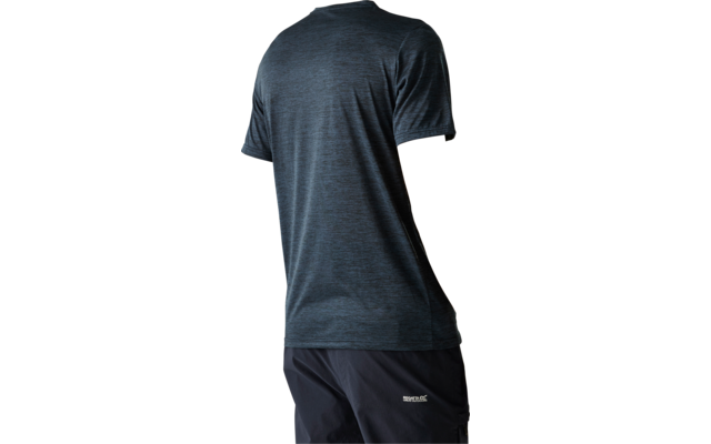 Person seen from behind wearing a blue short-sleeve T-shirt and dark shorts with a small white logo, looking over their shoulder against a light background