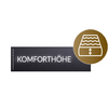 Black sign with the word Komforthöhe and a round symbol showing a roof window with an arrow pointing up and down