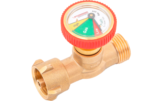 Gros plan d'une vanne en laiton avec un manomètre rond (vert, jaune, rouge) à bordure rouge et deux raccords filetés