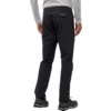 Rückenansicht einer Person in schwarzer Hose und grauem Pullover, die steht