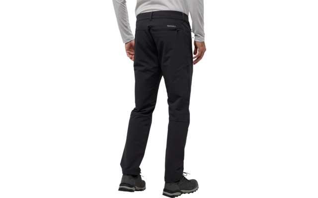 Rückenansicht einer Person in schwarzer Hose und grauem Pullover, die steht