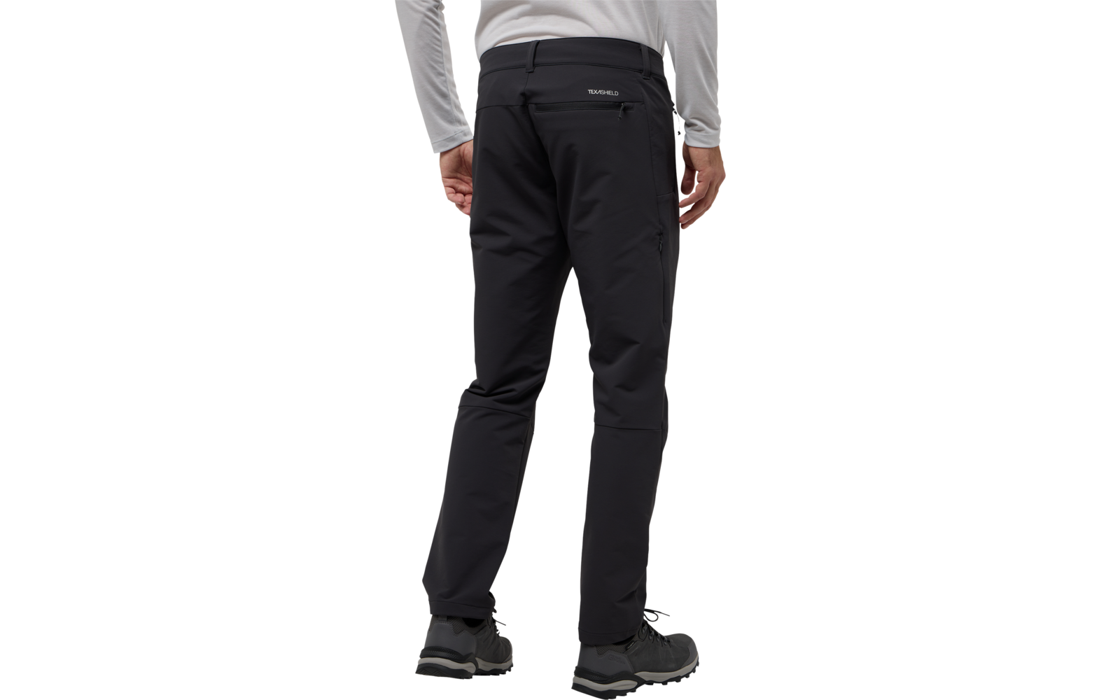 Rückenansicht einer Person in schwarzer Hose und grauem Pullover, die steht
