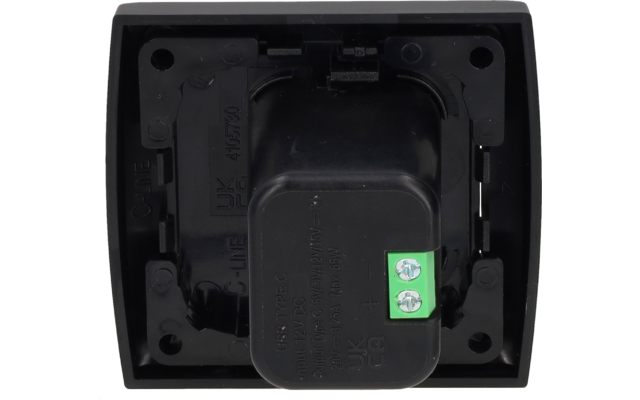 Boîtier rectangulaire en plastique noir avec saillie rectangulaire centrale, trous de fixation visibles en haut et en bas, texte embouti C-LINE UK et marquages numériques, bornier vert à deux pôles avec deux vis