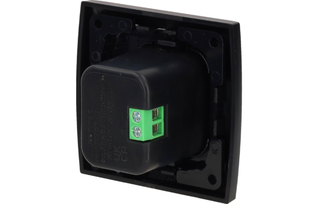 Plaque carrée en plastique noir avec un insert cylindrique noir et un bornier vert à deux pôles avec deux vis