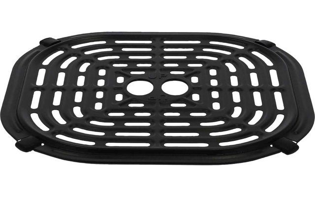 Schwarzes, rechteckiges Gitter mit abgerundeten Ecken, geschwungenen Schlitzen, zwei ovalen Öffnungen in der Mitte und kleinen seitlichen Griffen