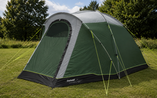 Green-gray pitched tent with closed arched door, fluorescent guy lines, black hem with 'Outwell' logo, on grass with trees and a blue sky with clouds