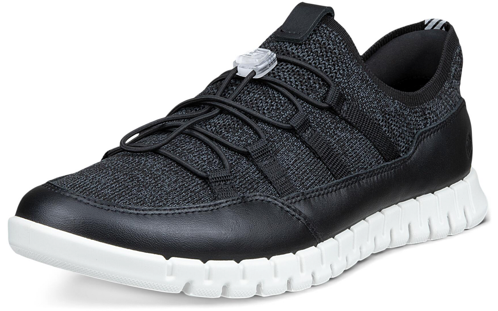 Zapatilla negra con empeine de punto gris, puntera de piel negra, suela blanca segmentada y cordones elásticos con tope, vista lateral