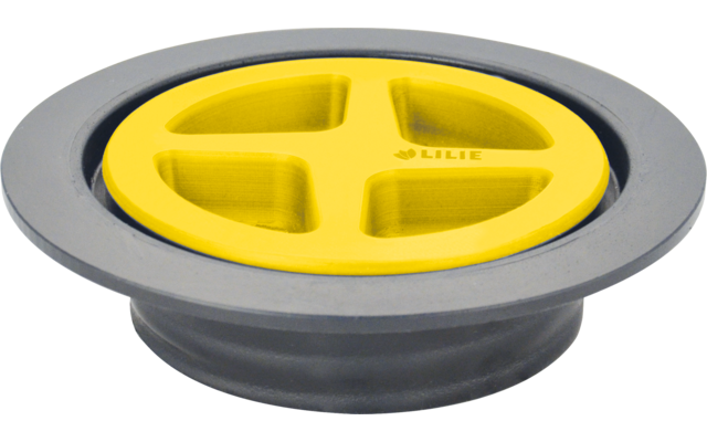 Copertura rotonda grigia con inserto giallo a forma di croce e quattro aperture rettangolari