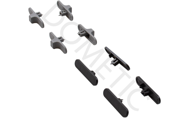 Zehn schwarze und graue Kunststoffteile auf weißem Hintergrund angeordnet