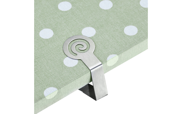 Clip en métal avec motif en spirale sur tissu vert clair à pois blancs à une bordure