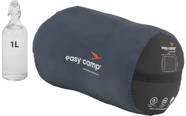 Coussin gonflable bleu foncé avec pompe à air et bouteille blanche