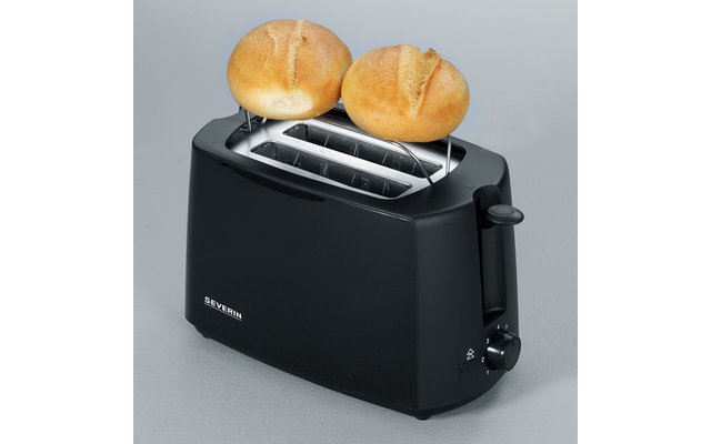 Schwarzer Toaster mit zwei Brötchen in den hochgestellten Schlitzen auf grauem Untergrund
