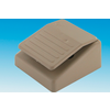 Beige rectangular foot pedal with a ridged top surface on a blue-to-white gradient background