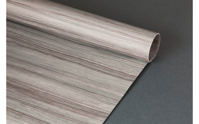 Aufgerollte Folie mit hellbraunen und grauen Holzmaserungen auf dunklem Hintergrund