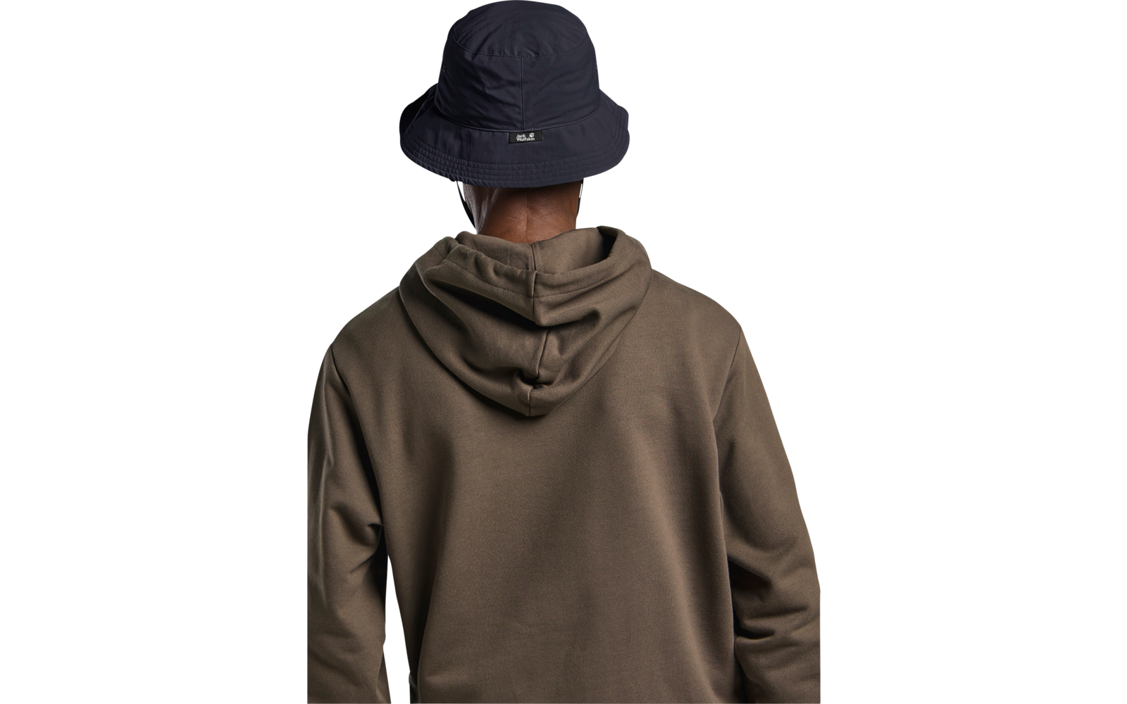 Rückenansicht einer Person mit dunkelblauem Anglerhut und olivgrünem Kapuzenpullover