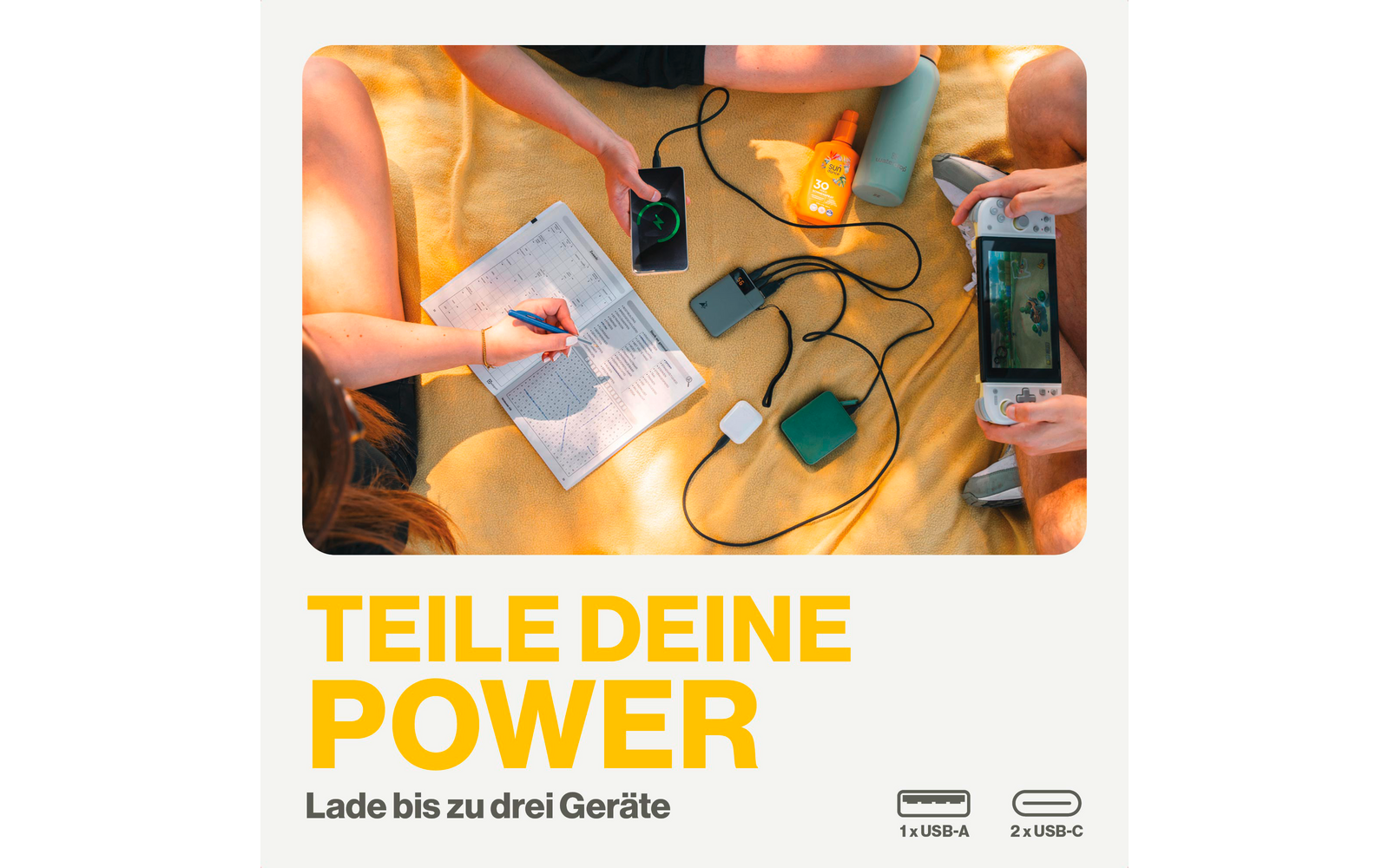 Twee mensen bedienen elektronische apparaten op een tafel met kabels en stekkers