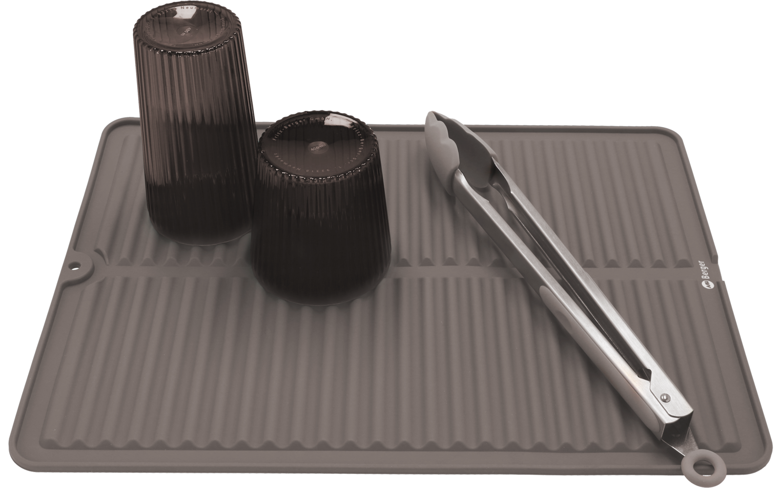 Graue Küchenmatte mit schwarzem Behälter, schwarzem Deckel und silbernem Stab darauf