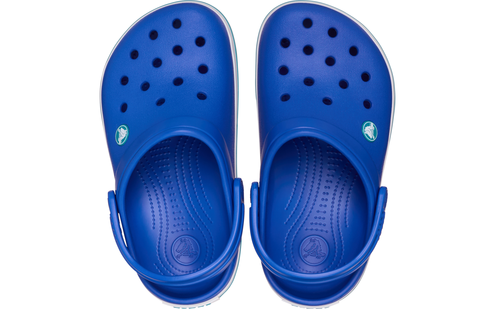 Paire de sabots bleus vue de dessus, perforations sur le dessus, brides talonnières et semelles intérieures texturées