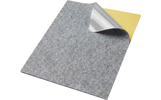 Gray rectangular felt sheet with one corner lifted, revealing a silver layer and a yellow layer underneath on a white background