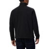 Vista trasera de una persona con chaqueta negra y pantalones oscuros