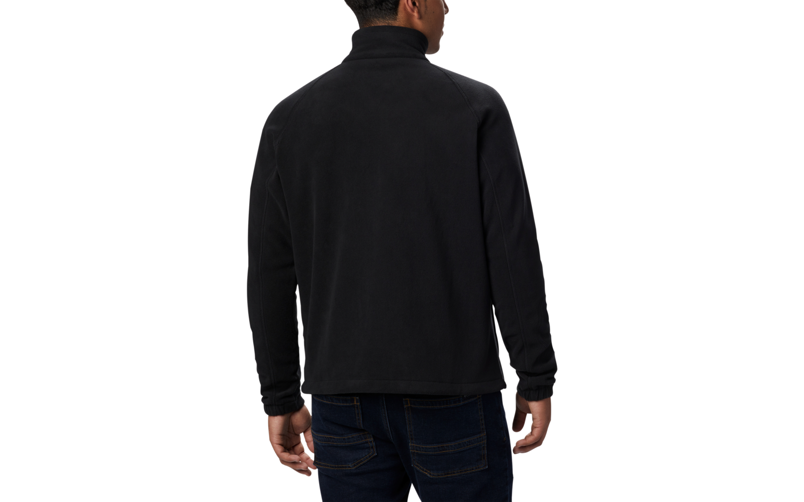 Vista trasera de una persona con chaqueta negra y pantalones oscuros