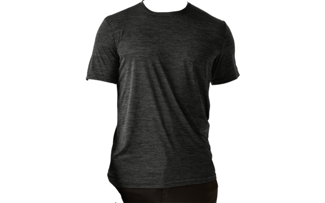 Man with short bleached blond hair and short beard, wearing a dark gray heather T‑shirt, standing against a light background, arms relaxed at sides, small black tattoo on inner right forearm