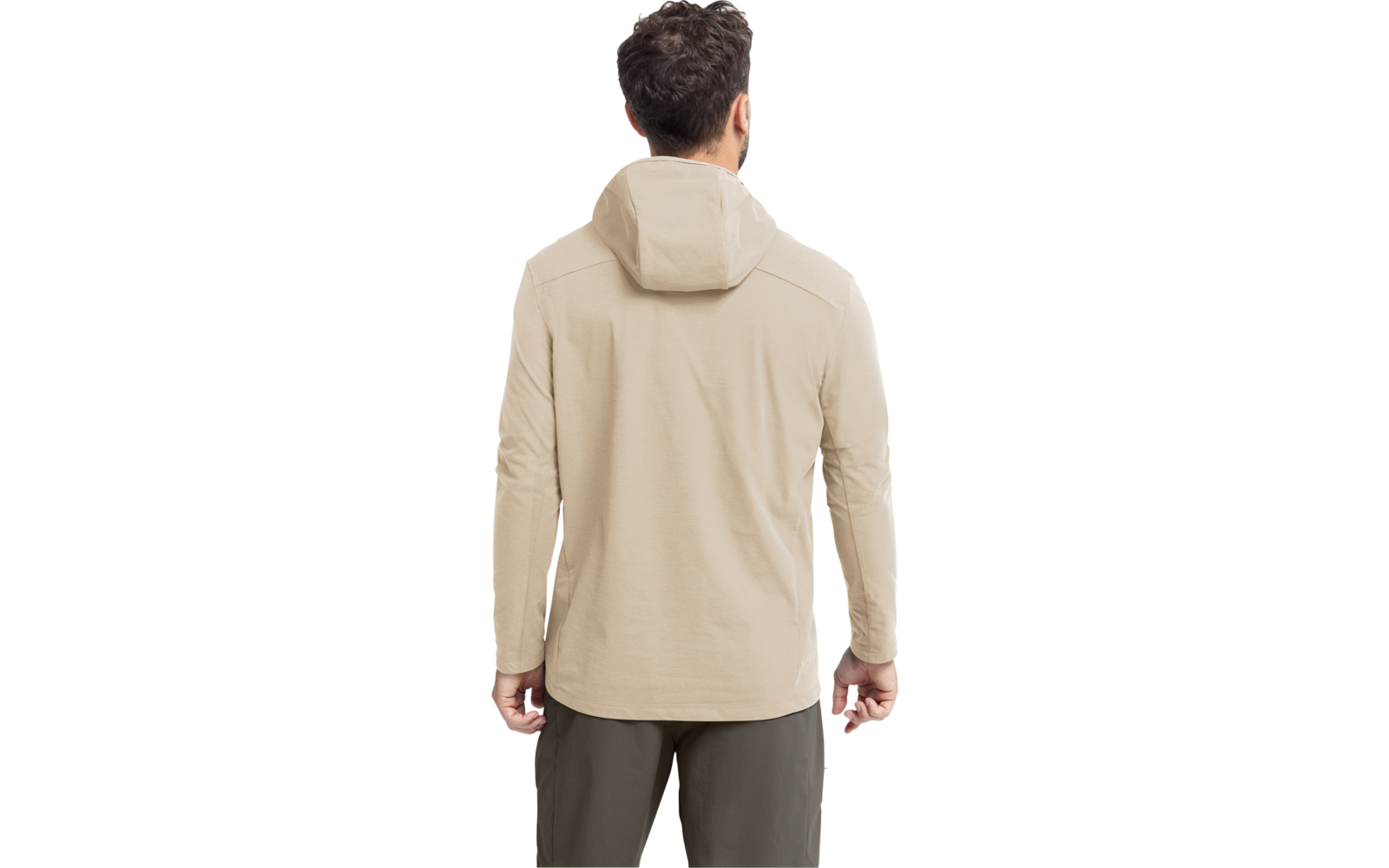 Person von hinten, beige Kapuzenjacke, olivgrüne Hose, kurze dunkle lockige Haare, Hände seitlich sichtbar