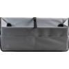 Sac en tissu gris avec compartiments sur une surface sombre