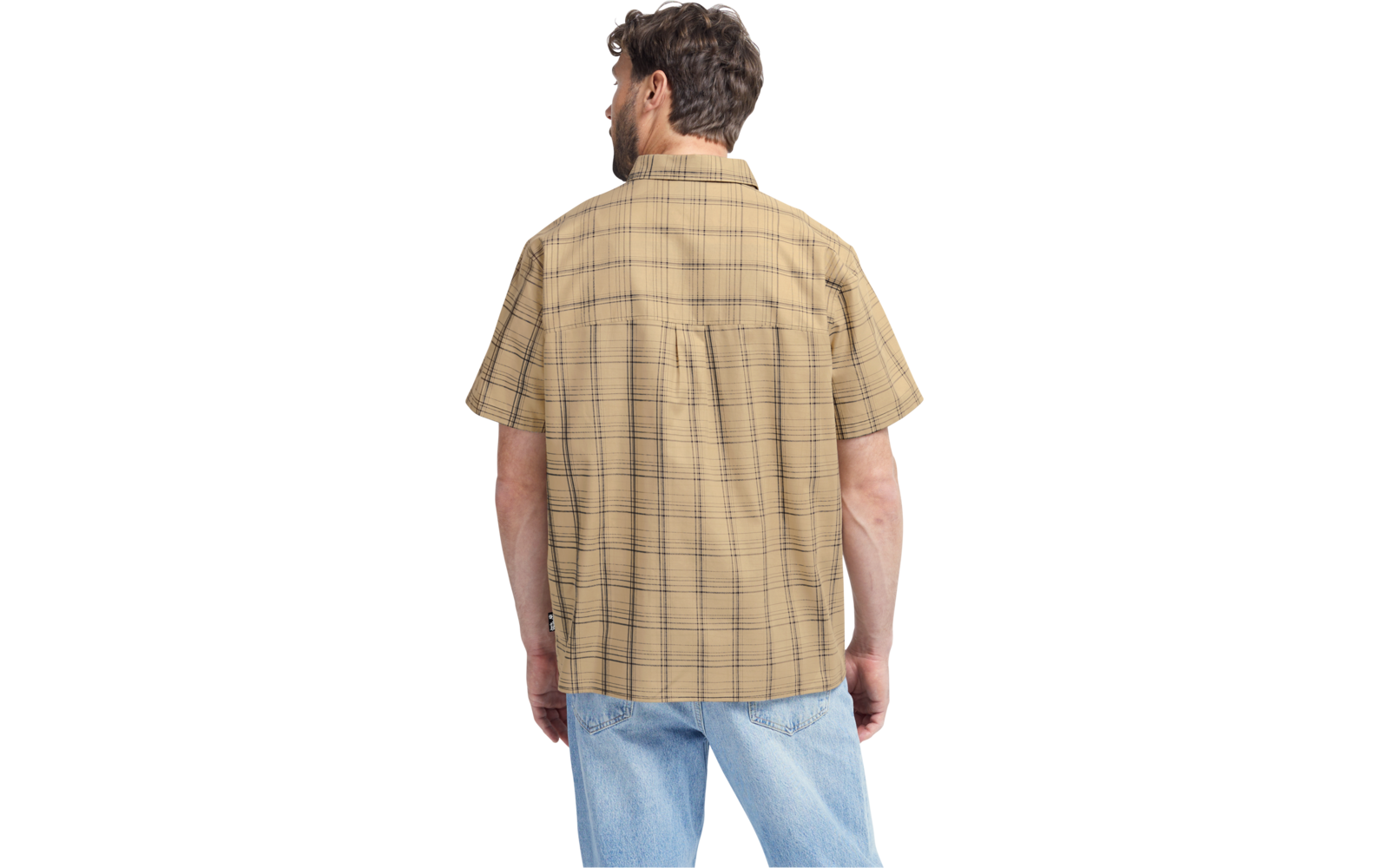 Person von hinten, trägt ein beige kariertes kurzärmeliges Hemd und hellblaue Jeans