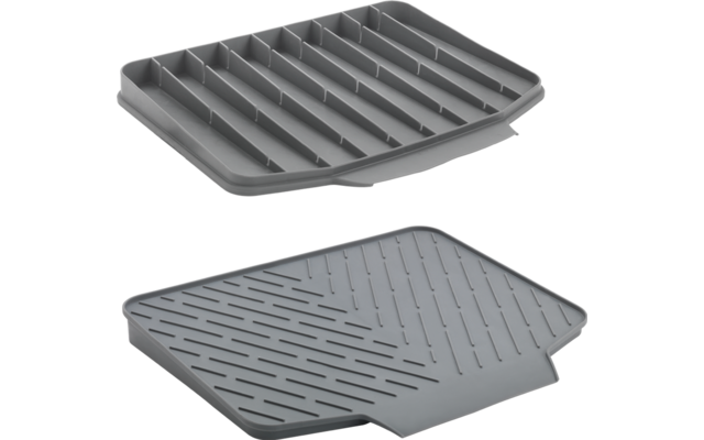 Twee grijze grillplaten met groeven, één op de ander geplaatst