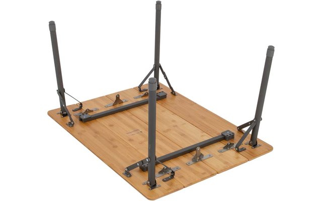 Wood tabletop with four folded metal legs and hardware, underside visible