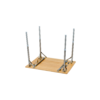 Upside-down rectangular wooden tabletop with four metal folding legs raised on a white background