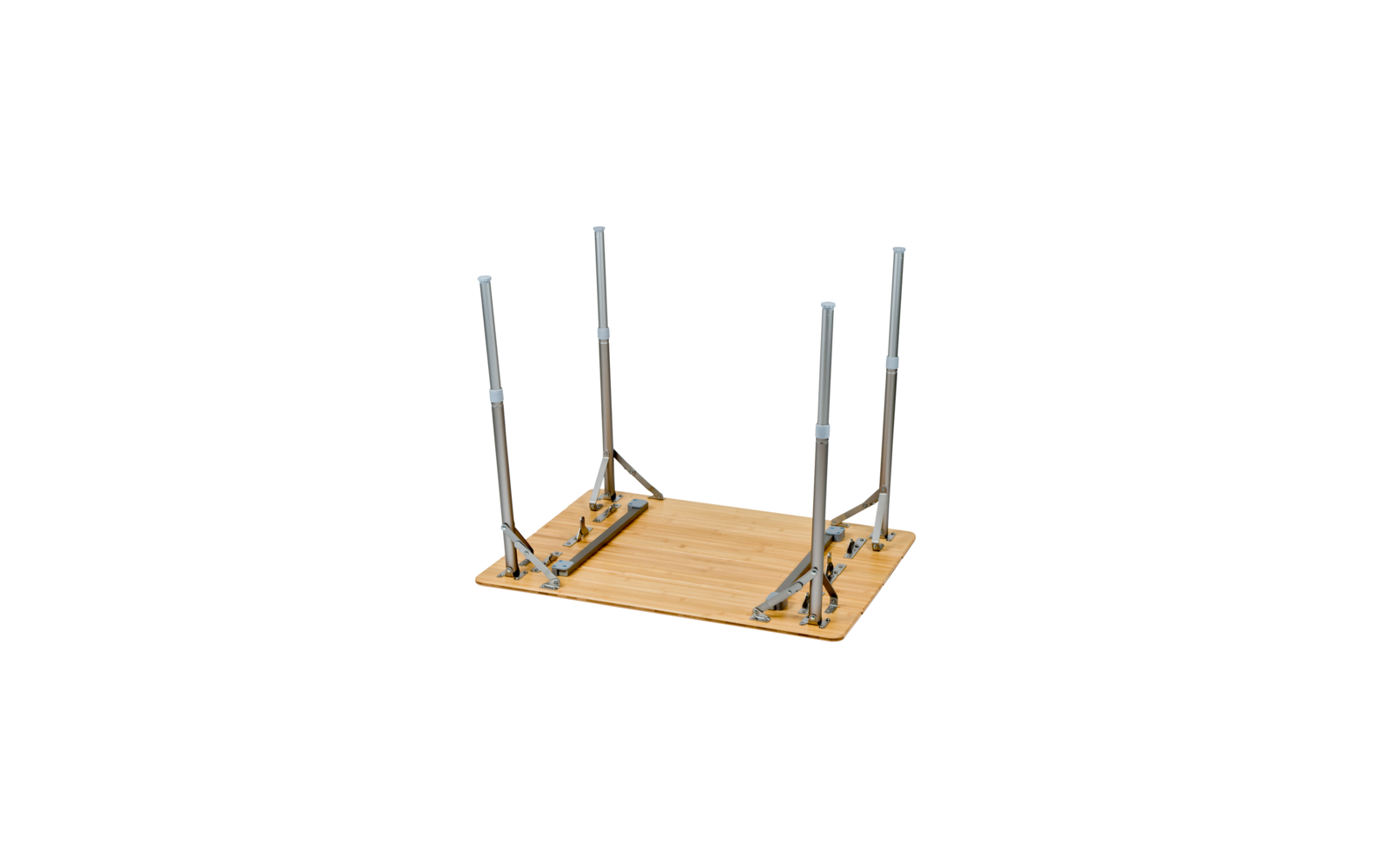 Upside-down rectangular wooden tabletop with four metal folding legs raised on a white background