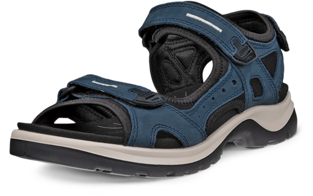 Une sandale bleue à bout ouvert, deux fermetures auto-agrippantes, doublure noire et semelle blanche