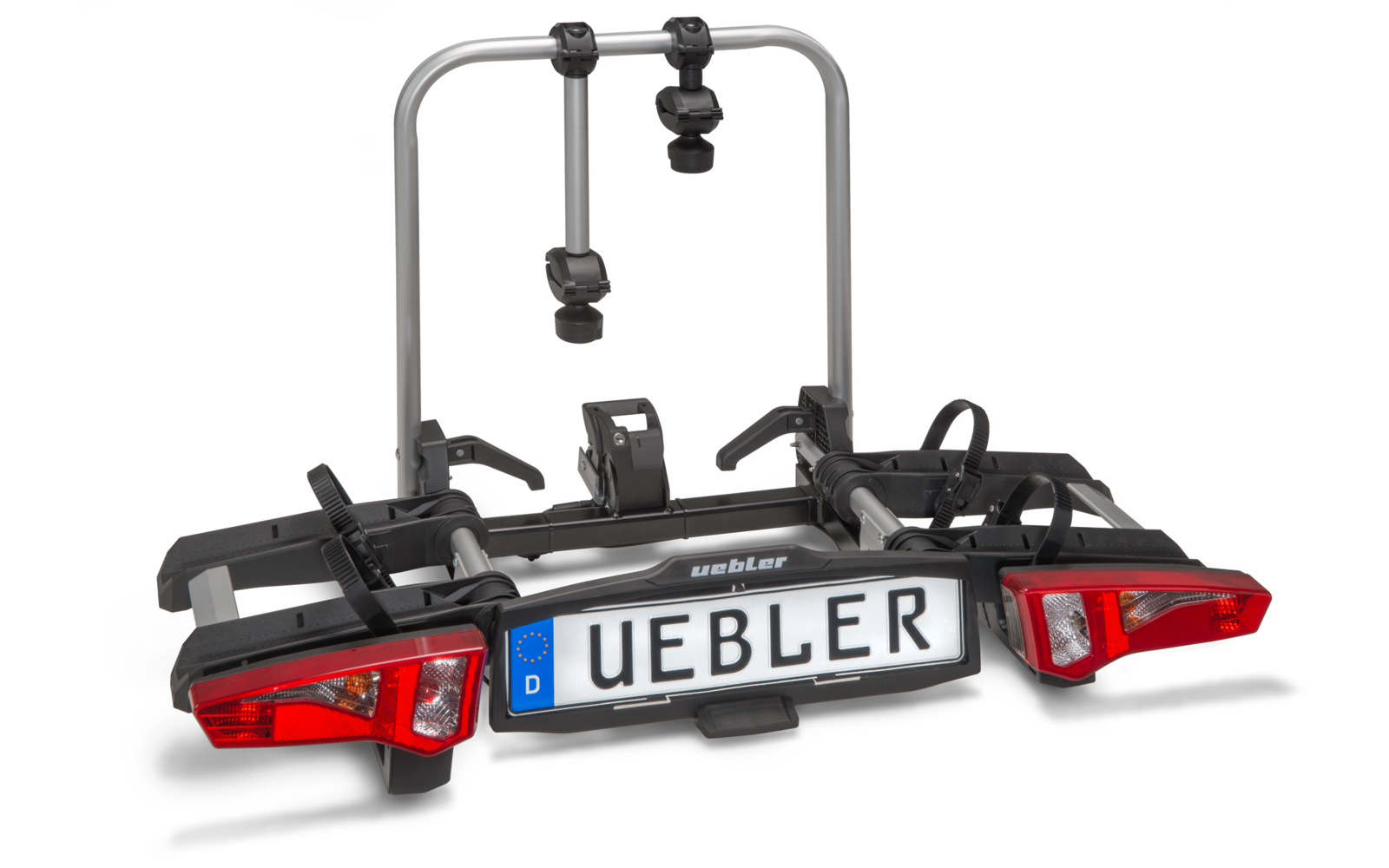 Metallrahmen mit zwei vertikalen Stangen, zwei roten Rücklichtern, Kunststoffhalterungen, Riemen und Nummernschild mit Aufschrift 'UEBLER'
